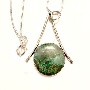 Quantum Cuatrro, 925 marked, 1 1/2 inch pendant on a silver chain.